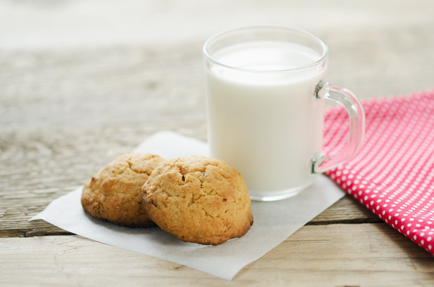 cup of milk with oatmeal cookies - 写真・画像