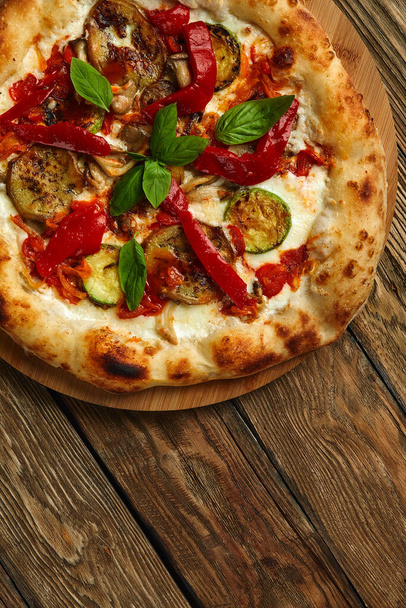 pizza vegetables tomato, onion, pickles, mushrooms, etc. vegan or vegetarian food ready to eat no meat portion on the table for healthy meal snack outdoor top view copy space food background rustic - Photo, Image
