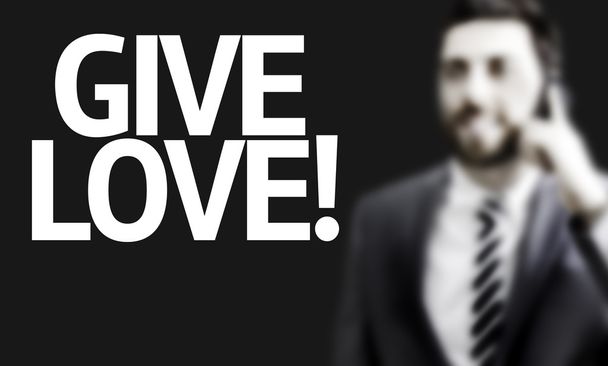 Hombre de negocios con el texto Give Love en una imagen conceptual
 - Foto, Imagen