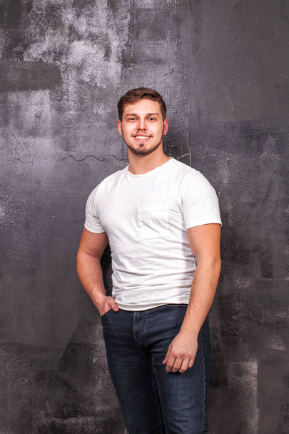 Portrait of a young guy in a white t-shirt - Photo, Image