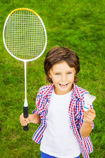 Little boy holding badminton racket and shuttlecock - Foto, Imagem