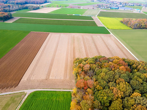 Aerial view of agricultural fields. fields at farmland. drone photo - Φωτογραφία, εικόνα