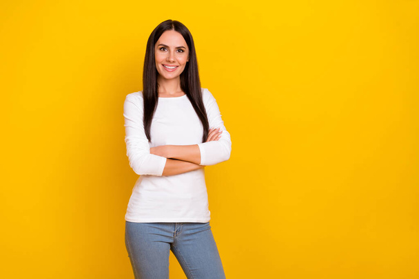 Photo of young cheerful woman crossed hands corporate economist isolated over yellow color background - Fotografie, Obrázek