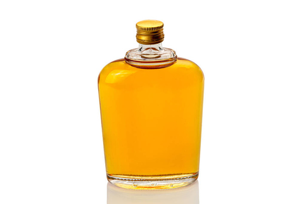 Glass whiskey hip flask, or whisky or bourbon,  closeup isolated on white, clipping path - Foto, imagen