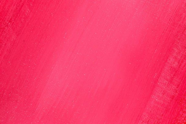 яскраво-червоний фон: товста акрилова фарба, нанесена тонким нерівним шаром на плоску поверхню, світлі та темні ділянки
  - Фото, зображення