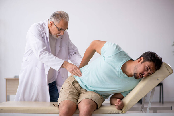 Young male patient visiting old male doctor - Photo, Image