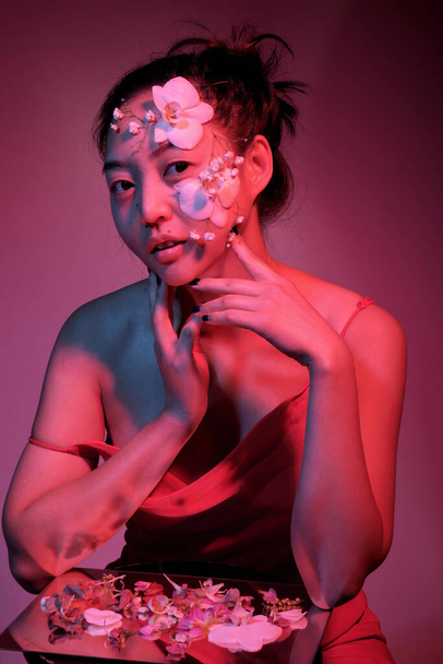 Asian woman with flowers on her face - Zdjęcie, obraz