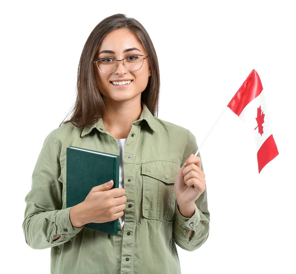 カナダ国旗を白地に持つ若い女子学生 - 写真・画像