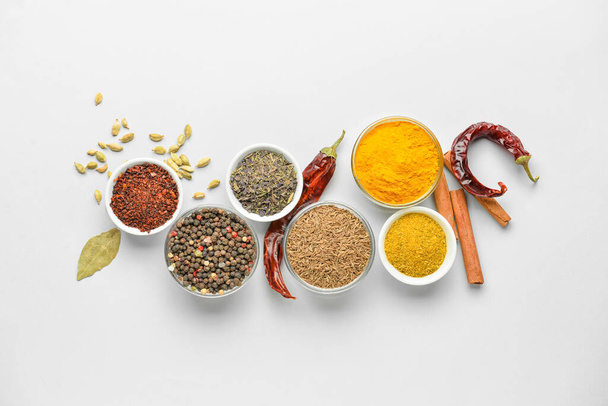 Bowls with aromatic spices on white background - Photo, Image