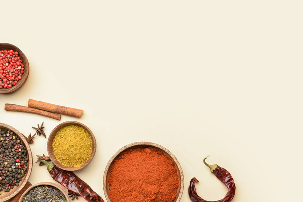 Bowls with aromatic spices on yellow background - Photo, Image