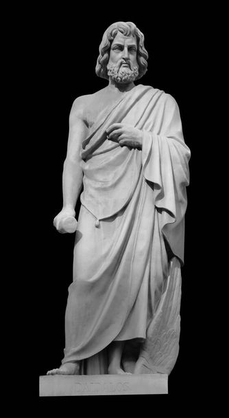 Statue of the biblical inventor Daedalus. Ancient sculpture isolated on black background. Classic antiquity man portrait - Photo, Image