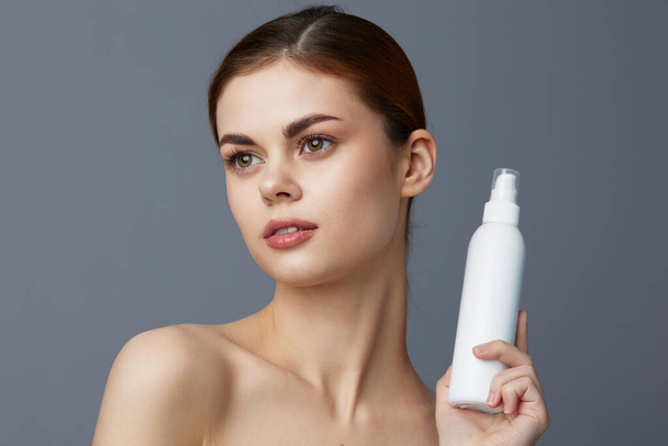 young woman  with body lotion close-up Lifestyle. High quality photo - Foto, immagini