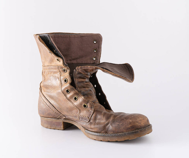 Old shoes on a white background. Leather brown shoe. Worn shoes. - Фото, изображение