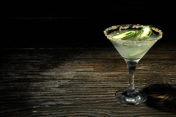 Glass of Jalapeno cocktail on rustic wooden background - Photo, image