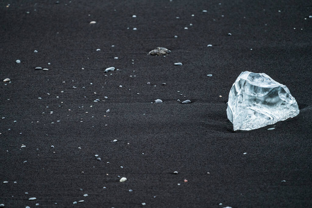 Ice diamond over diamonds beach in Jokulsarlon - Photo, Image