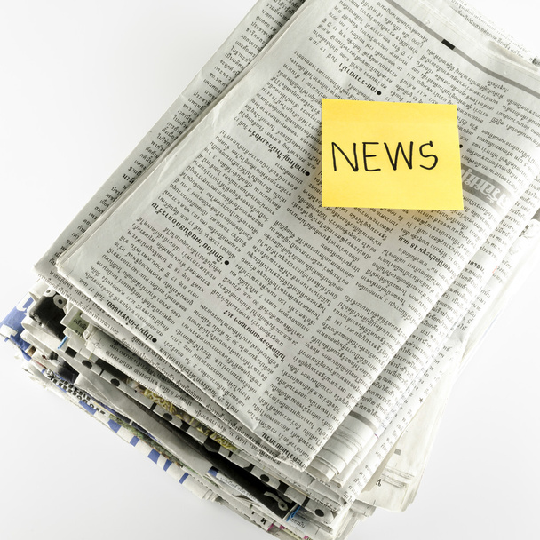 stack of newspaper with post it write news word - Фото, изображение