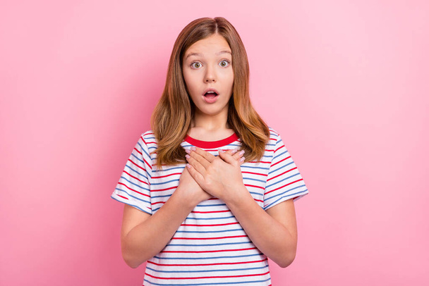 Photo of staring teen brown hairdo girl hands heart isolated on pink color background - 写真・画像