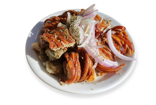 kokoretsi meat traditional in greece hot  in the plate with onion and oregano  - Photo, Image