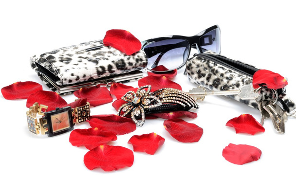 A Red rose petals, women's accessory Handbag for keys, sunglasses, wallet, watch. in still life - Foto, Bild