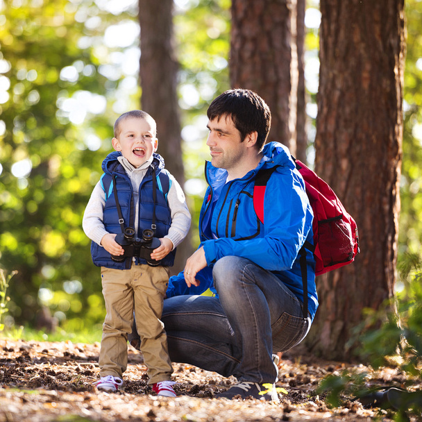 Father and son in the forest - Foto, Imagen