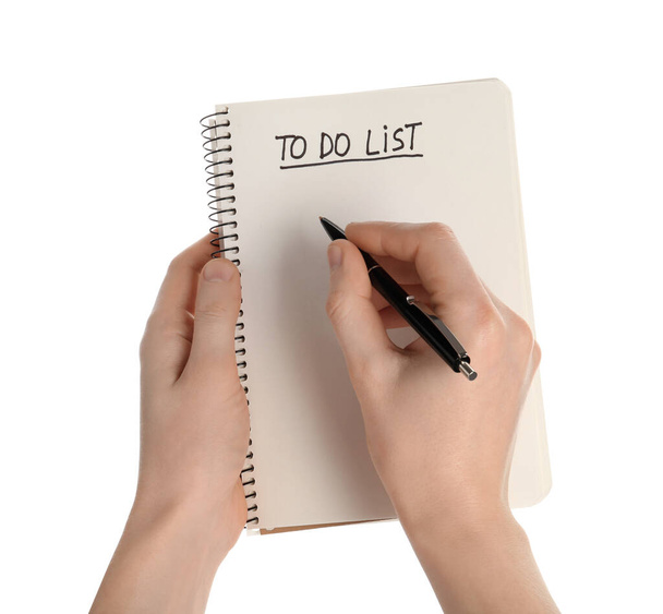 Woman filling To Do list in notepad on white background, closeup - Фото, зображення