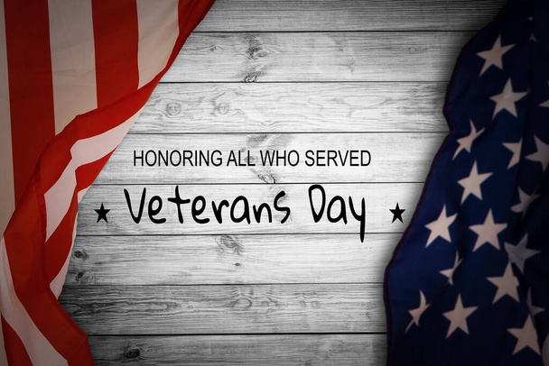 Happy Veterans Day concept. Vintage American flags against blackboard background. November 11. - Фото, изображение