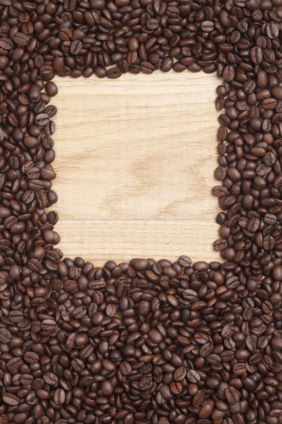 Caffe edition, coffee beans on a wooden background - Фото, зображення