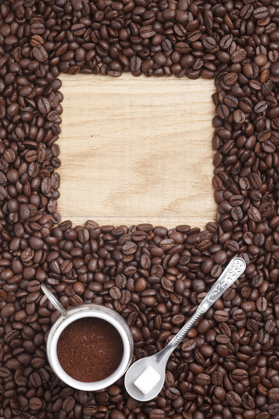 Caffe edition, coffee beans on a wooden background - Photo, Image