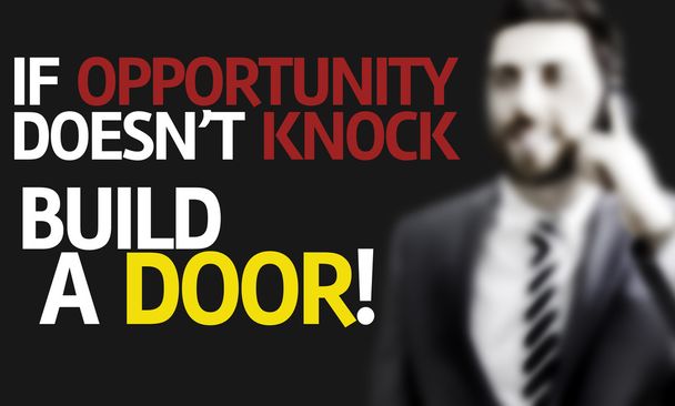 Business man with the text If Opportunity Doesn't Knock Build a Door in a concept image - Photo, Image