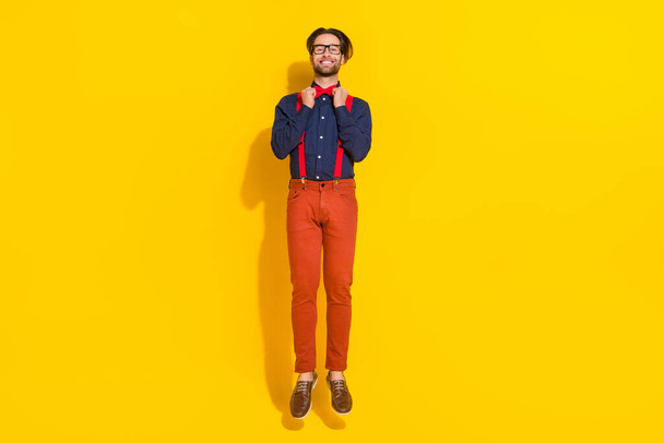 Full size photo of young man jump up correct bowtie party well-dressed isolated over yellow color background - Φωτογραφία, εικόνα