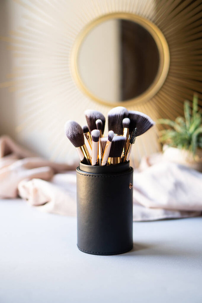 Set of luxurious black makeup brushes in leather case - Photo, Image