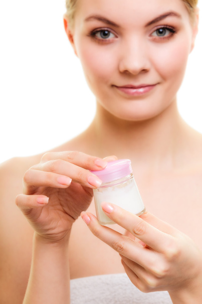 Girl applying moisturizing cream - Фото, зображення