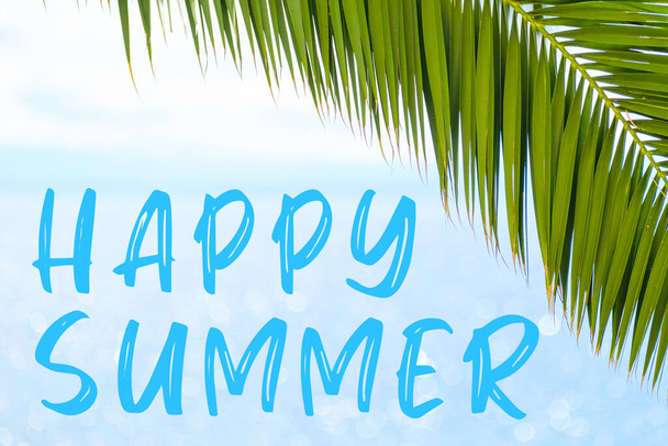 Happy summer text on the background with palm leaf and blue sea. Template of a greeting card, postcard or advertisement of a tour agency - Photo, Image
