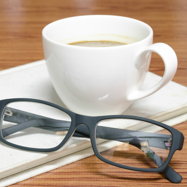 coffee cup and notebook with glasses - Φωτογραφία, εικόνα