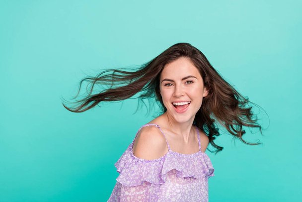 Portrait of attractive cheerful girl good mood throwing hair having fun isolated over bright blue color background - Φωτογραφία, εικόνα