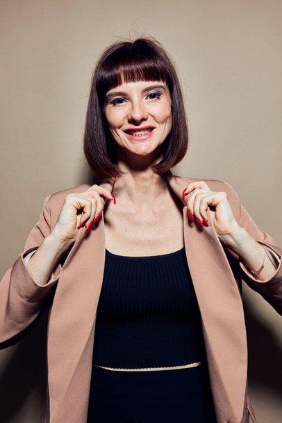 beautiful woman short haired suit gesturing with hands isolated background - Foto, Imagen