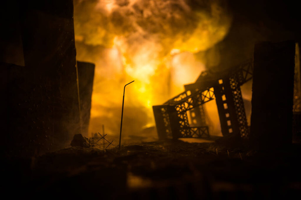 Nuclear war concept. Explosion of nuclear bomb. Apocalyptic view of city downtown after bombing. Night scene. City destroyed by war. - Photo, Image