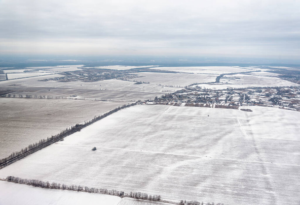 Ukraine winter landscape fields and roads view from the plane - Photo, Image