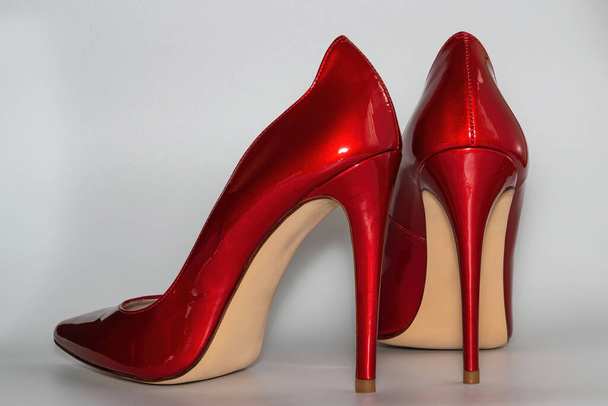 Red colored high heeled womens shoes from the back view. - Zdjęcie, obraz