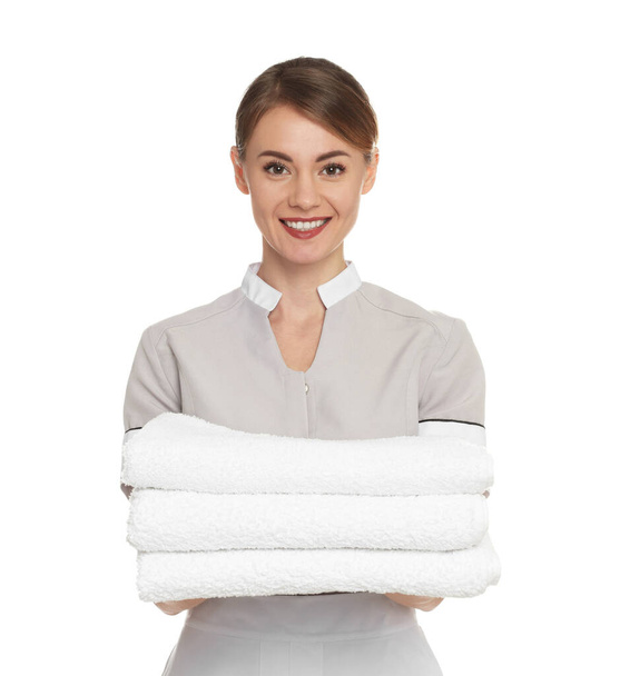 Portrait of chambermaid with towels on white background - Фото, зображення