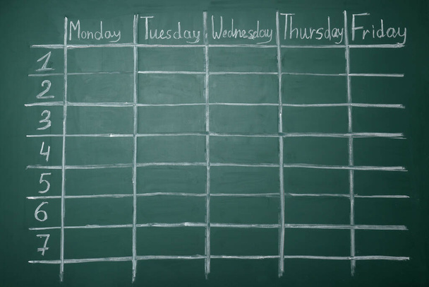Weekly school timetable drawn on green chalkboard - Foto, Imagem