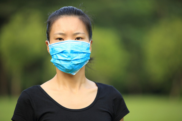 Asian woman wear face mask - Фото, изображение