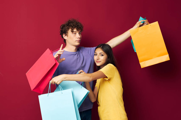 cute young couple colorful bags shopping fun Lifestyle unaltered - Photo, Image
