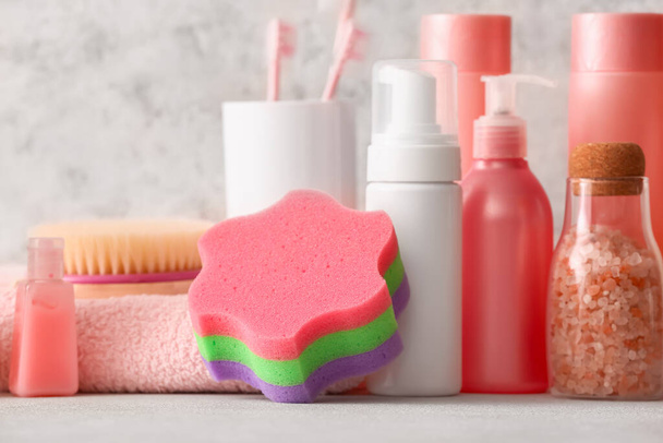 Set of different cosmetic products and bath accessories on light background, closeup - Φωτογραφία, εικόνα