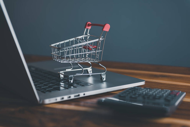 Market E-commerce, Online Shopping Payment Concept, Business Marketing Ecommerce Via Online Network. Mini Shopping Card on Computer Laptop for Market E-Commerce Advertisement. - Photo, Image