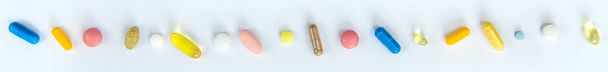 Supplements and vitamins on a white background. Selective focus. Medicine. - Fotó, kép