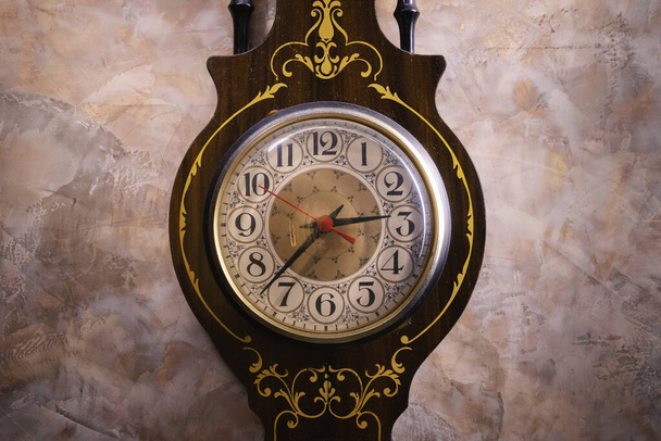 Conceptual art, details of an old retro watch hanged on retro designed wall. - Фото, зображення