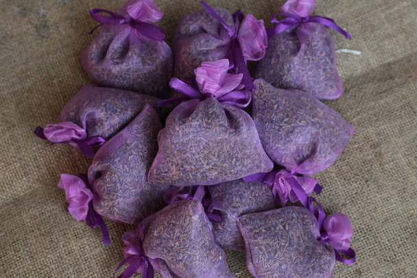 Dried lavender aroma sachet on rustic background. Lavender refreshener. - Φωτογραφία, εικόνα