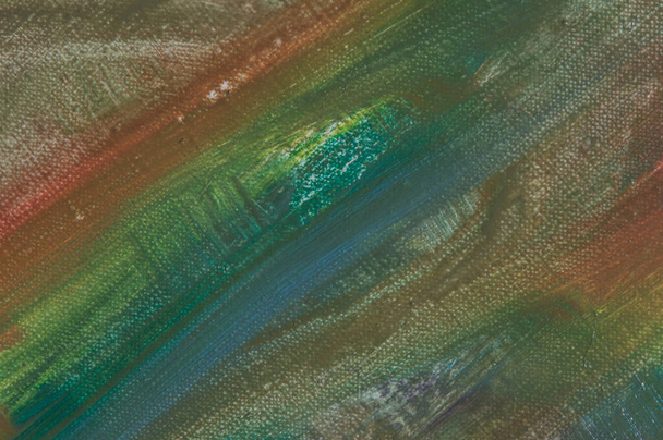 abstrakti sateenkaari monivärinen tausta muodostuu pyyhkimällä maaleja kankaalta, lyhyt keskittyä. Ei taide-esine, väliaikainen vaikutus.  - Valokuva, kuva