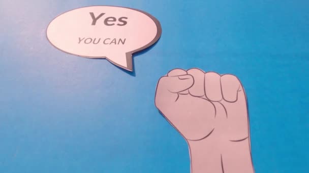 Human hand showing thumb up against motivation text written on speech bubble isolated on blue background. Conceptual image shows that you have the capability strength and ability to achieve goal. - Footage, Video
